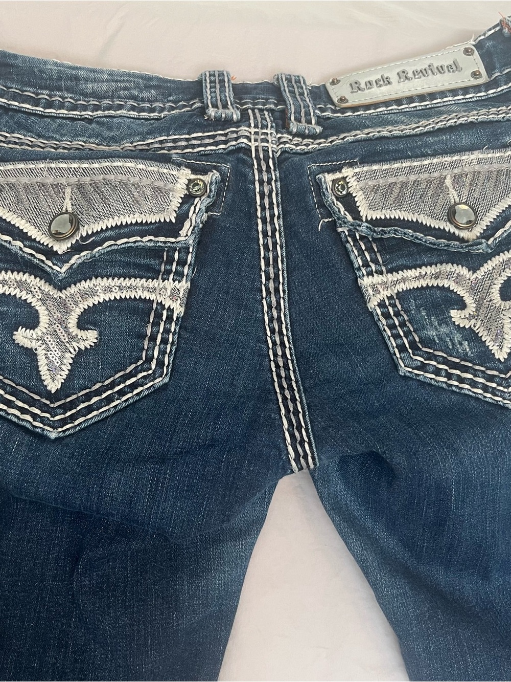 Rock Revival Women's Dark Blue Jeans with White Embroidered Pockets